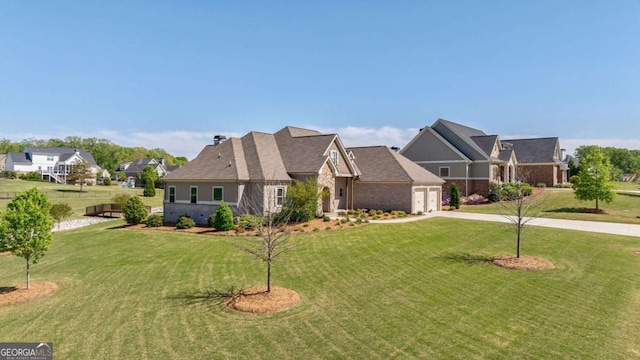 2424 Princeton Bend Way, Bogart, GA 30622 - view of front of house with driveway, a front yard, a garage, brick siding, and a residential view