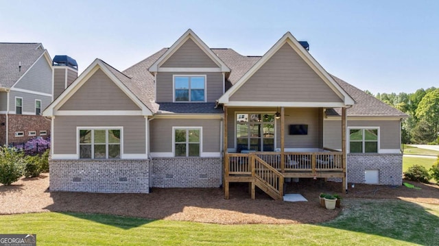 2424 Princeton Bend Way, Bogart, GA 30622 - rear view of house featuring brick siding, a yard, a wooden deck, and roof with shingles