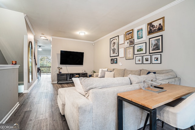living room featuring baseboards, crown molding, and dark wood-style floors