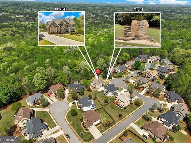 bird's eye view with a view of trees and a residential view