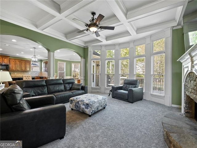 living room featuring recessed lighting, a ceiling fan, beam ceiling, a fireplace, and carpet flooring