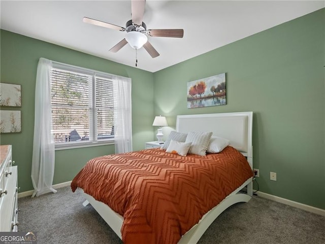carpeted bedroom featuring baseboards and ceiling fan
