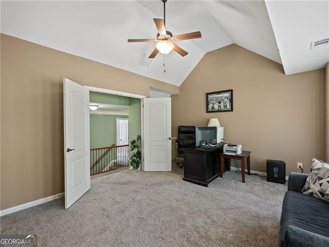 office space featuring a ceiling fan, carpet floors, baseboards, lofted ceiling, and visible vents