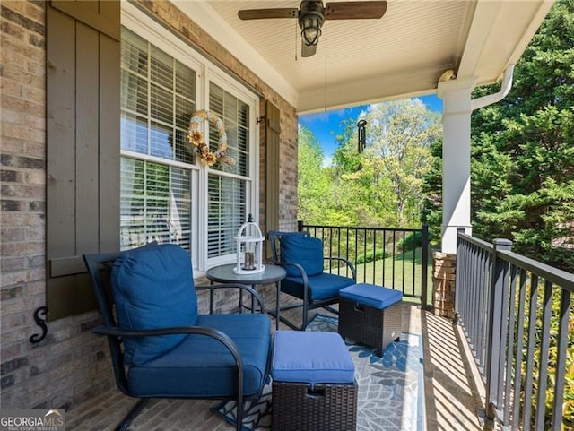 balcony featuring a ceiling fan and a porch