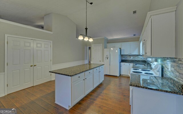 2800 Araglin Dr, Dacula, GA 30019 - kitchen featuring tasteful backsplash, white appliances, white cabinetry, ornamental molding, and a kitchen island