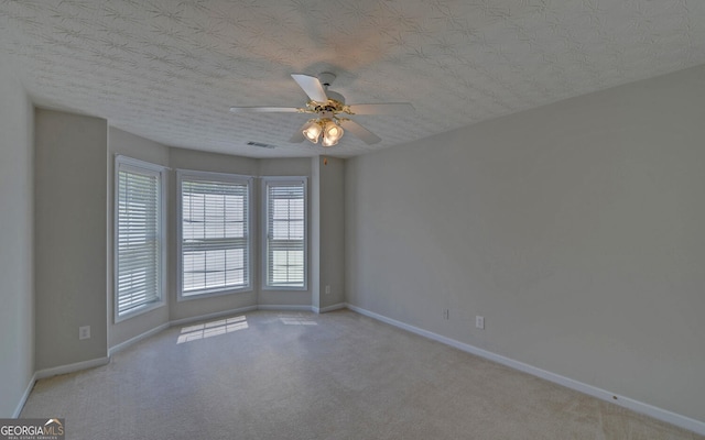2800 Araglin Dr, Dacula, GA 30019 - spare room featuring carpet floors, visible vents, baseboards, and ceiling fan