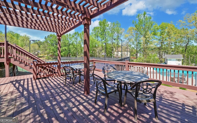2800 Araglin Dr, Dacula, GA 30019 - wooden deck with a pergola, a fenced backyard, outdoor dining area, and stairs