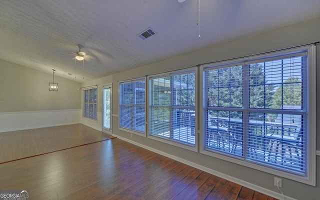 2800 Araglin Dr, Dacula, GA 30019 - spare room with vaulted ceiling, a ceiling fan, visible vents, baseboards, and dark wood-style floors