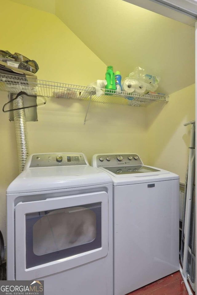 washroom with washer and clothes dryer