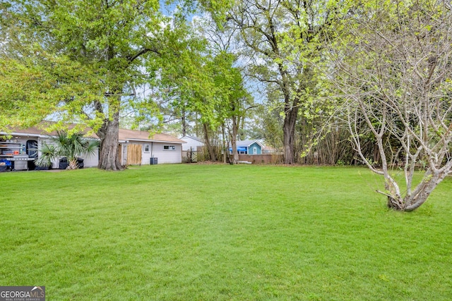 view of yard with fence