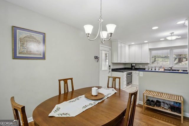 1649 Clairmont Way NE, Brookhaven, GA 30329 - dining space featuring wood finished floors, recessed lighting, and a notable chandelier