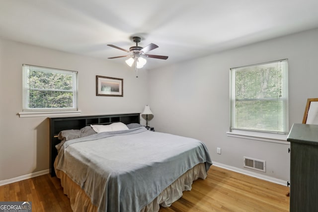 1649 Clairmont Way NE, Brookhaven, GA 30329 - bedroom with baseboards, a ceiling fan, wood finished floors, and visible vents