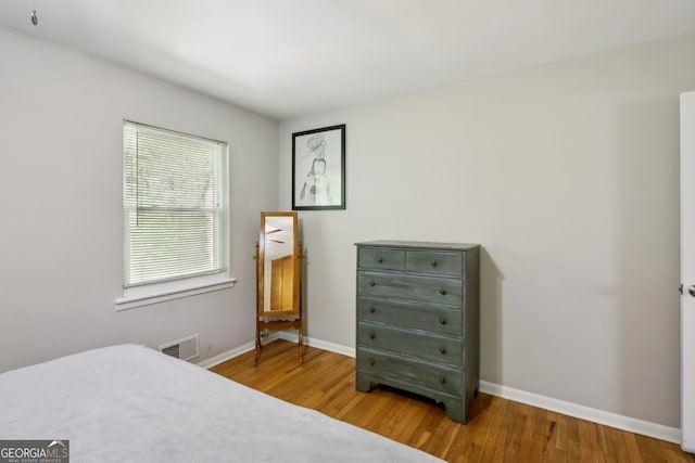 1649 Clairmont Way NE, Brookhaven, GA 30329 - bedroom with baseboards, wood finished floors, and visible vents