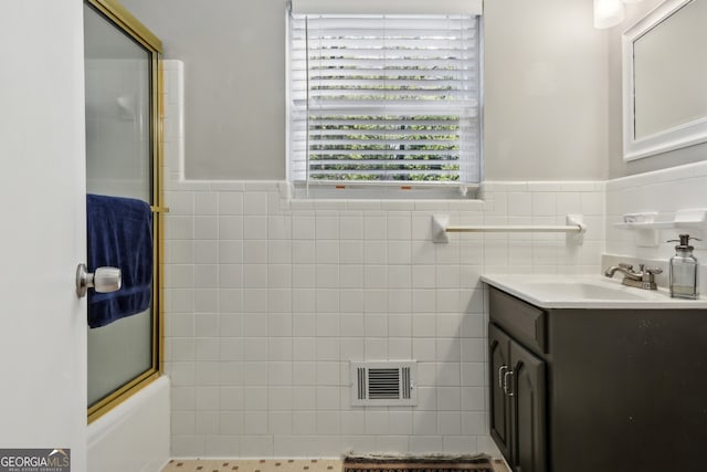 1649 Clairmont Way NE, Brookhaven, GA 30329 - full bathroom featuring tile walls, visible vents, vanity, and wainscoting