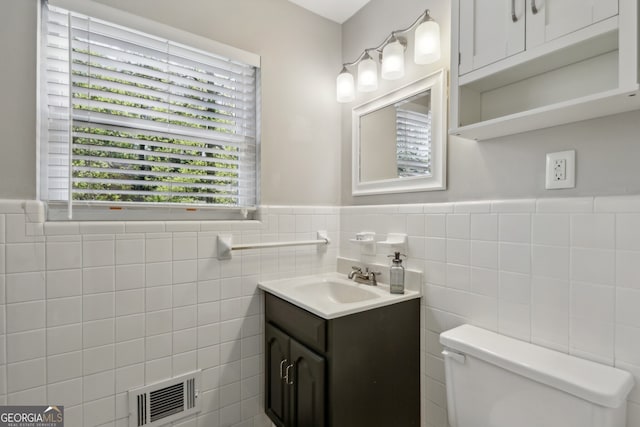 1649 Clairmont Way NE, Brookhaven, GA 30329 - bathroom with tile walls, visible vents, toilet, and wainscoting
