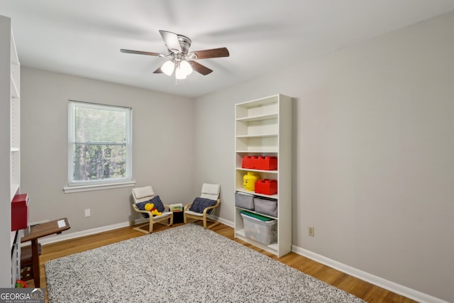 1649 Clairmont Way NE, Brookhaven, GA 30329 - playroom featuring ceiling fan, baseboards, and light wood-style flooring