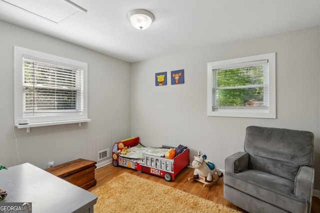 1649 Clairmont Way NE, Brookhaven, GA 30329 - bedroom with wood finished floors, visible vents, and multiple windows