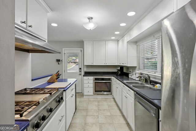 1649 Clairmont Way NE, Brookhaven, GA 30329 - kitchen with white cabinets, stainless steel appliances, a sink, and a wealth of natural light