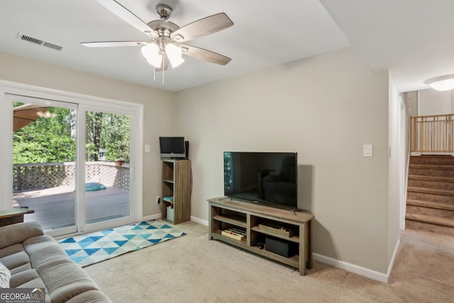 1649 Clairmont Way NE, Brookhaven, GA 30329 - carpeted living room with baseboards, visible vents, a ceiling fan, and stairs