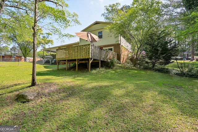 1649 Clairmont Way NE, Brookhaven, GA 30329 - back of house with a lawn, a wooden deck, fence, and brick siding