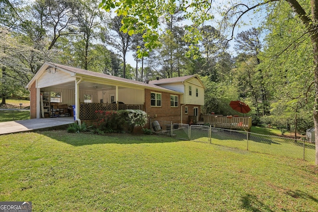 1649 Clairmont Way NE, Brookhaven, GA 30329 - exterior space with fence, a yard, driveway, a carport, and brick siding