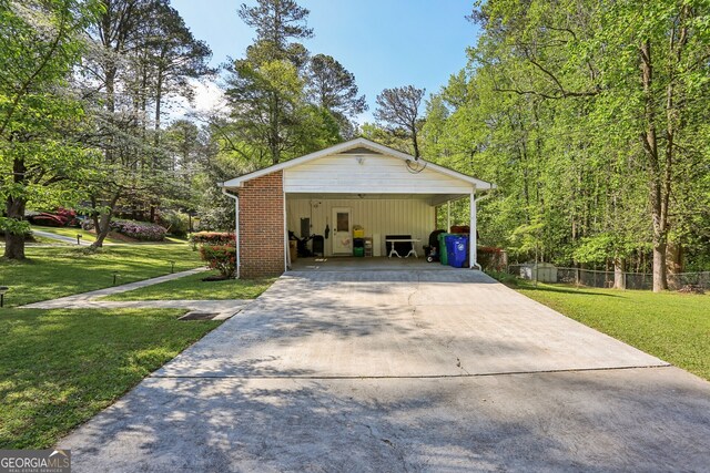 1649 Clairmont Way NE, Brookhaven, GA 30329 - exterior space with fence, brick siding, a front yard, and a detached garage