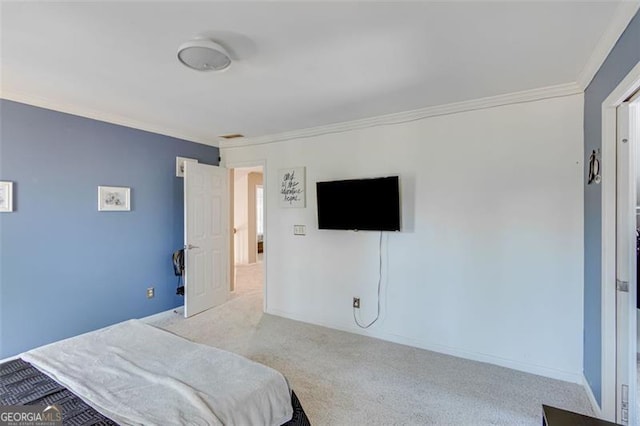 bedroom with carpet flooring and ornamental molding