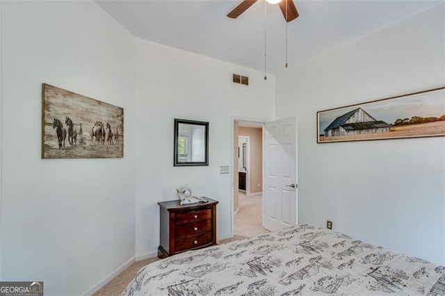 carpeted bedroom featuring ceiling fan, baseboards, and visible vents