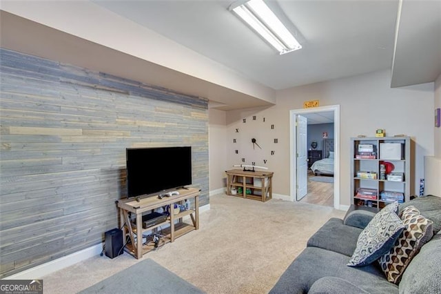 carpeted living room featuring baseboards