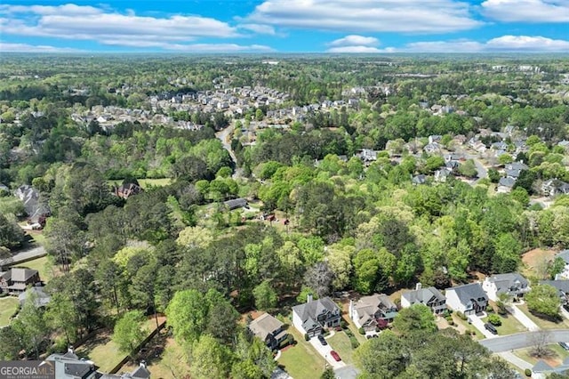birds eye view of property featuring a residential view and a forest view