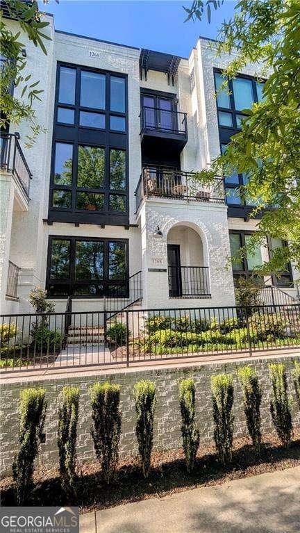 1268 Appleden Way Unit 17, Brookhaven, GA 30319 - view of building exterior featuring a fenced front yard
