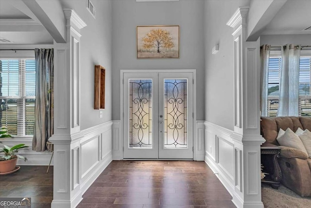 3206 Letha Woods Dr, Conyers, GA 30094 - entryway featuring french doors, dark wood-style floors, a decorative wall, and wainscoting