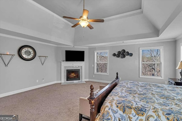 3206 Letha Woods Dr, Conyers, GA 30094 - bedroom featuring multiple windows, a tray ceiling, carpet floors, a high end fireplace, and crown molding