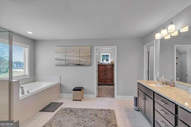 3206 Letha Woods Dr, Conyers, GA 30094 - full bath featuring vanity, a garden tub, and tile patterned floors