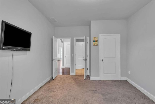 3206 Letha Woods Dr, Conyers, GA 30094 - unfurnished bedroom with carpet floors and baseboards