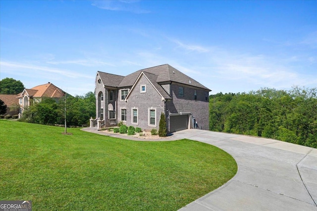 3206 Letha Woods Dr, Conyers, GA 30094 - view of front of house featuring an attached garage, concrete driveway, a front yard, and brick siding