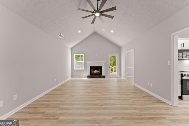unfurnished living room featuring light wood-style flooring, visible vents, and ceiling fan