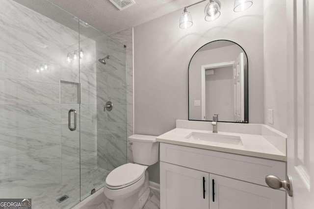 bathroom featuring a textured ceiling, a stall shower, vanity, toilet, and visible vents