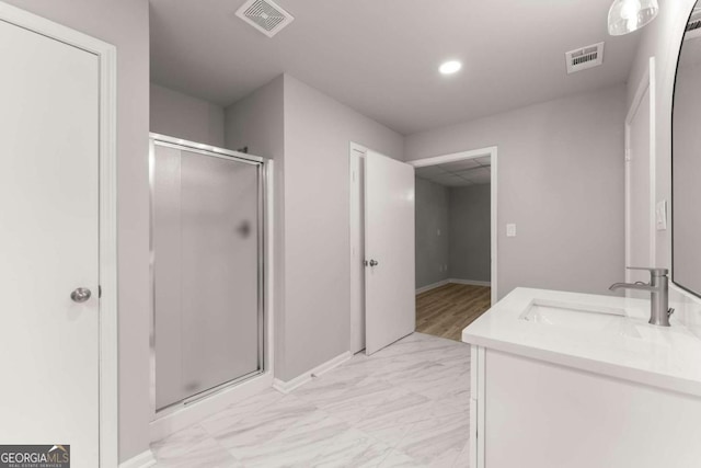 bathroom featuring baseboards, recessed lighting, visible vents, and a stall shower