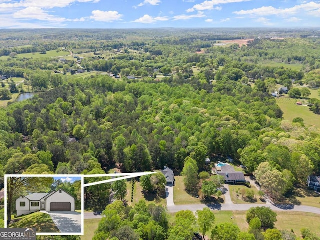 aerial view featuring a view of trees