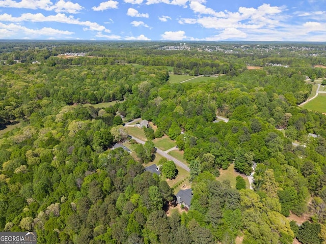 aerial view with a wooded view