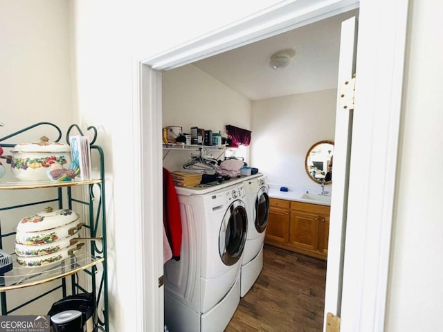 laundry room featuring separate washer and dryer, laundry area, and dark wood-style floors
