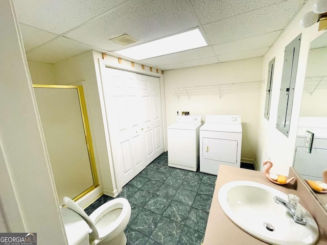bathroom with a paneled ceiling, visible vents, washer and clothes dryer, and a stall shower