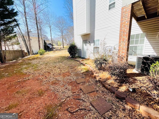 view of side of property with cooling unit
