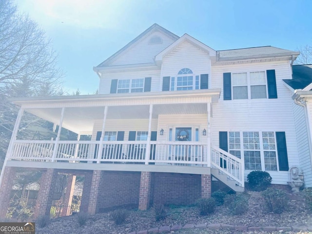 view of front facade featuring a porch and stairs