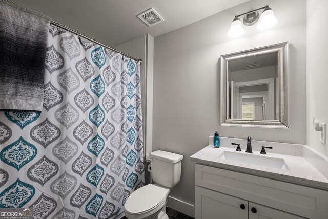 bathroom with a shower with shower curtain, visible vents, toilet, and vanity