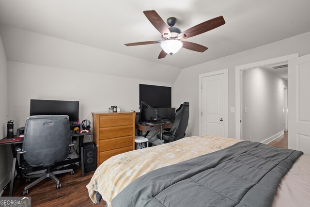 bedroom with visible vents, vaulted ceiling, wood finished floors, and ceiling fan