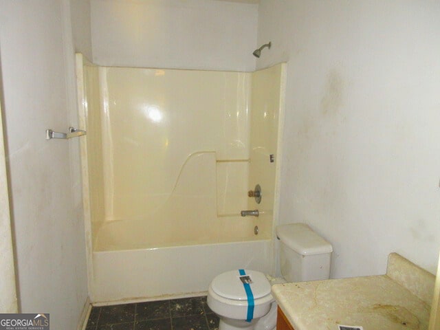 820 Haskell Ward Dr, Griffin, GA 30223 - bathroom featuring toilet, vanity, and washtub / shower combination