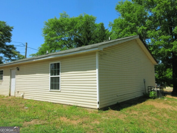 820 Haskell Ward Dr, Griffin, GA 30223 - view of side of home with a yard