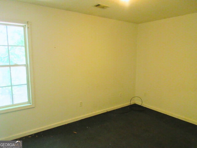820 Haskell Ward Dr, Griffin, GA 30223 - spare room with plenty of natural light, baseboards, and visible vents